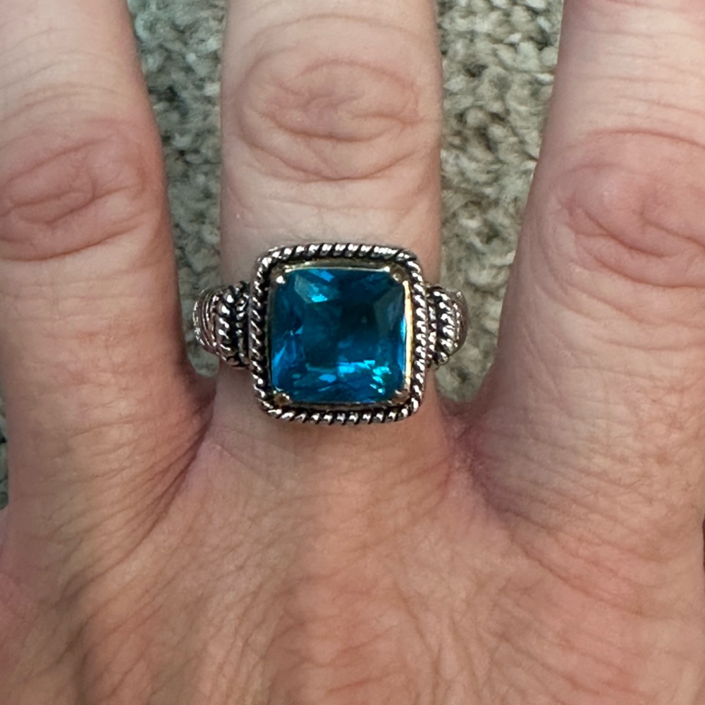 Turquoise blue stone in a silver colored band